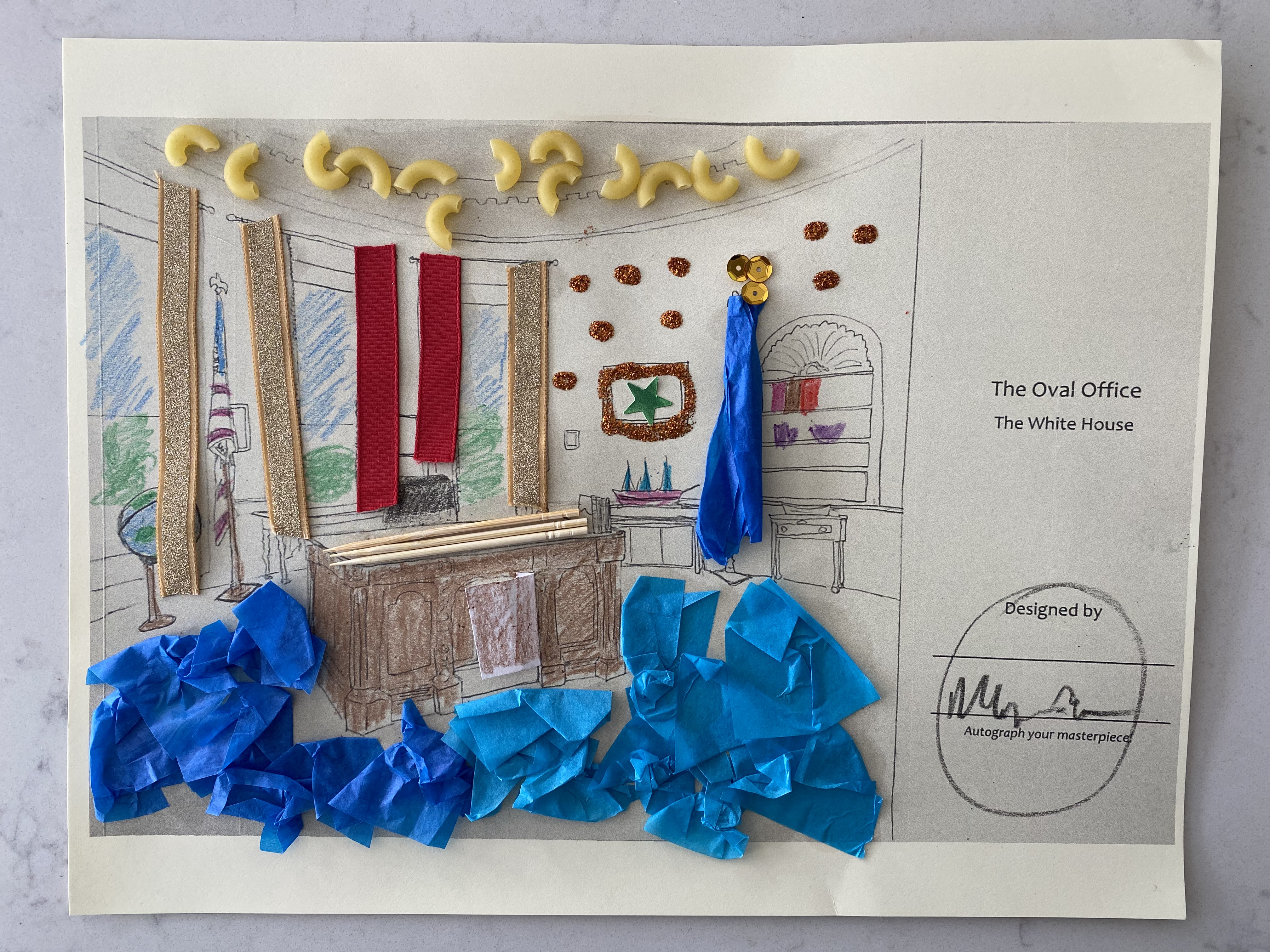 Outline of President Kennedy's Oval Office with craft materials glued onto the page. 